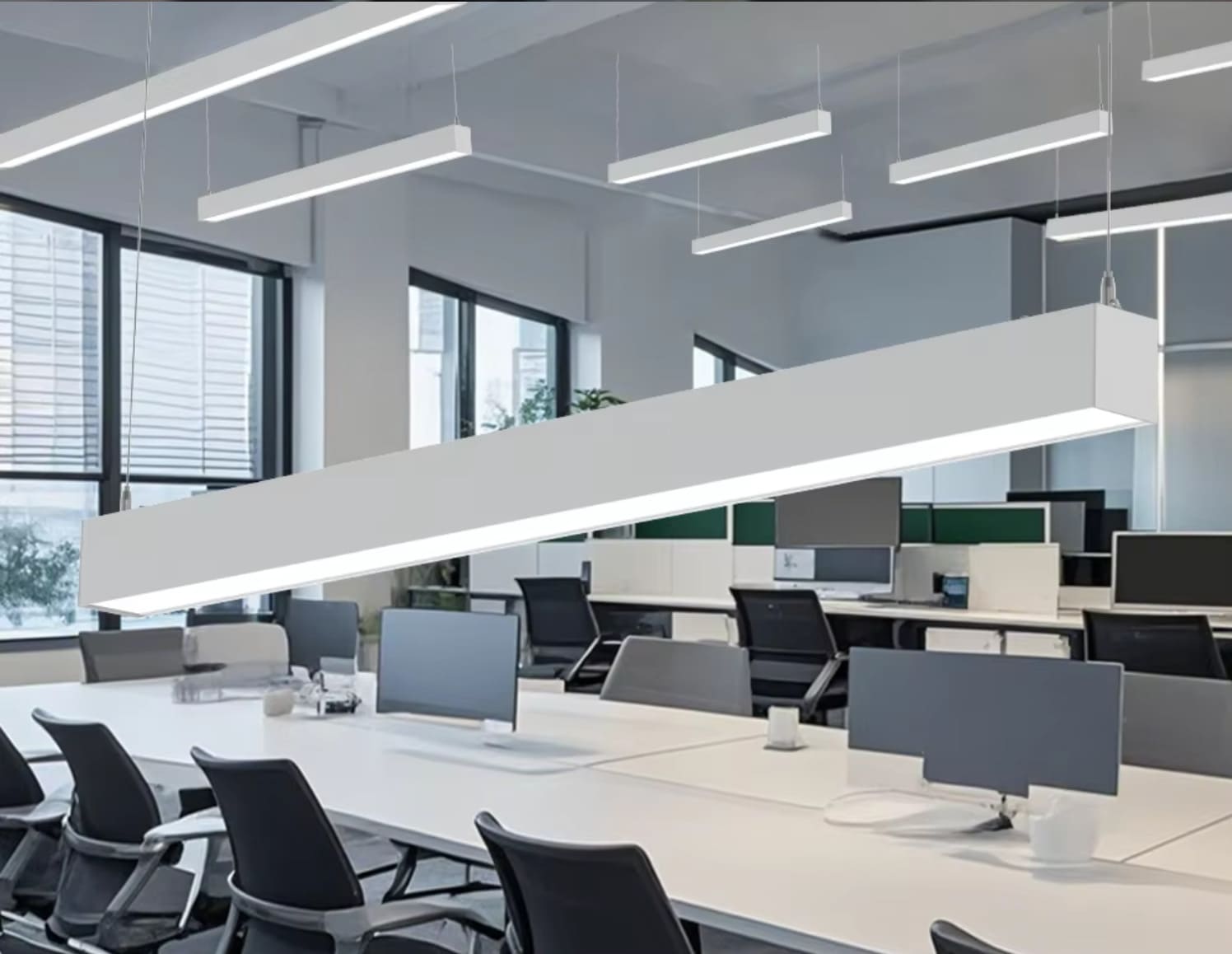 modern linear suspension lighting in commercial office space
